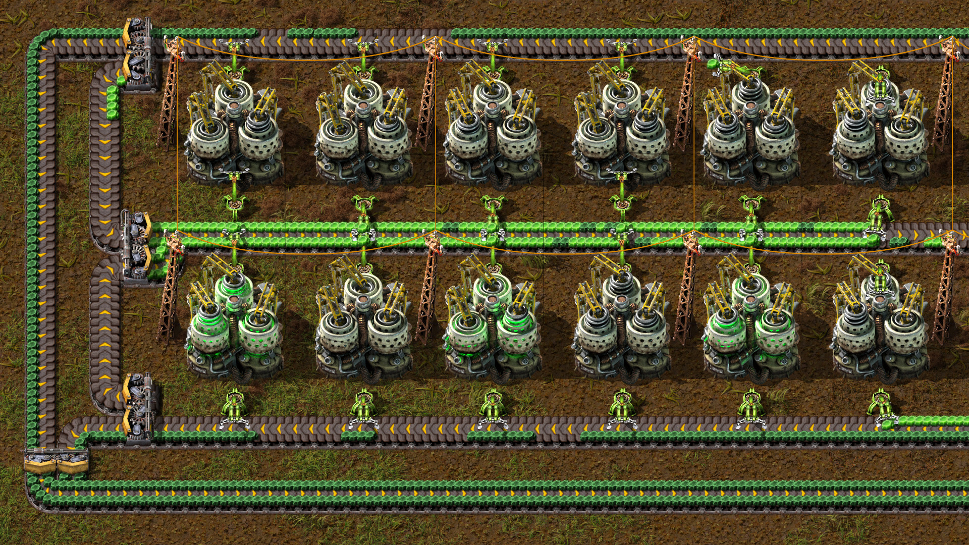 Factorio — Factorio factory with multiple machine units arranged in rows, linked by conveyor systems and piping.