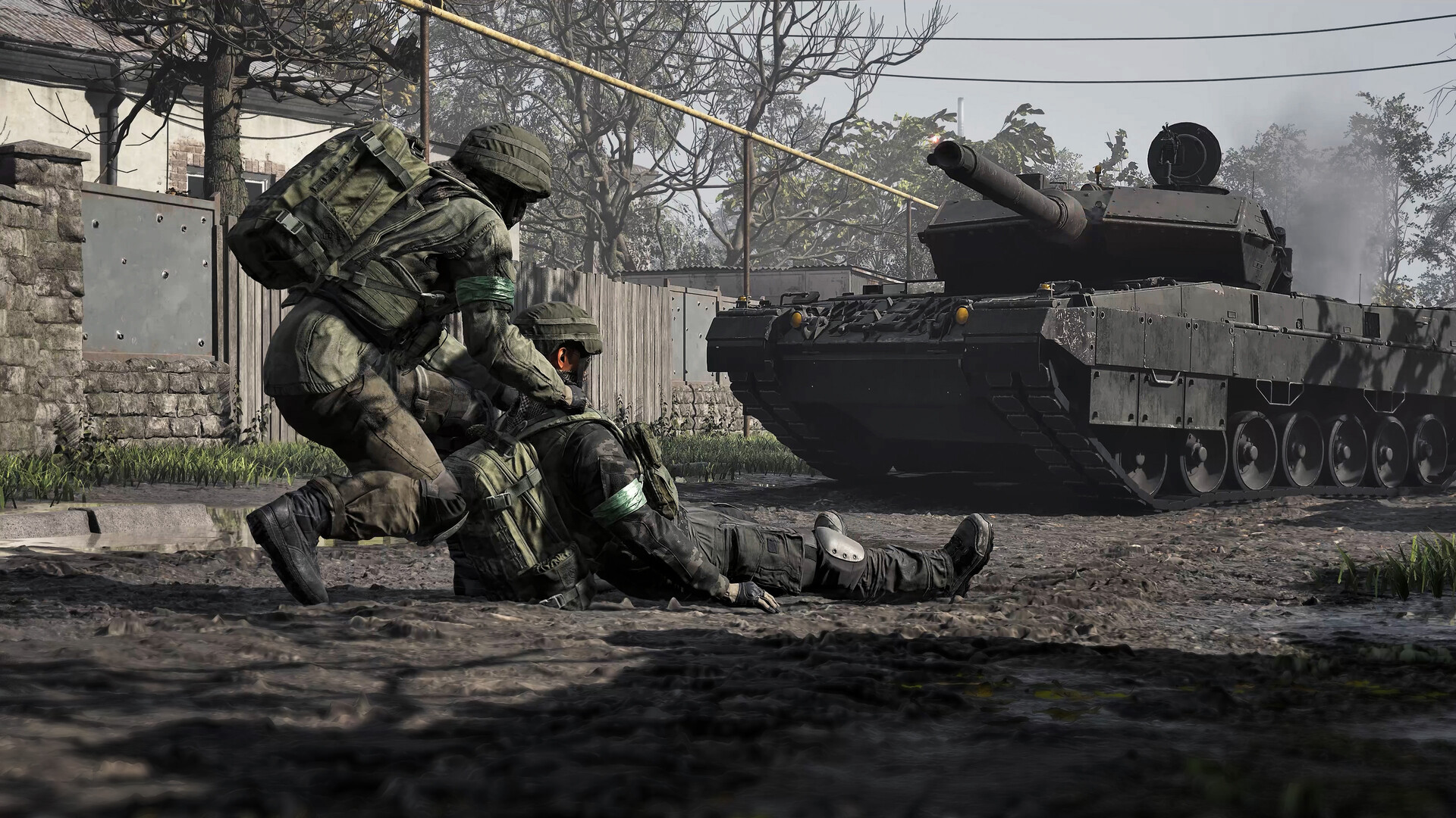 WARDOGS — Soldiers advance near a tank in a warzone setting.
