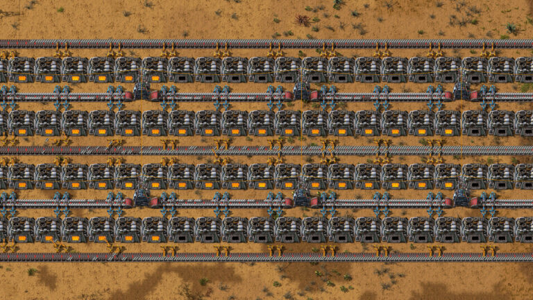Factorio — Factorio factory with multiple rows of machines and conveyor belts on a desert-like terrain.