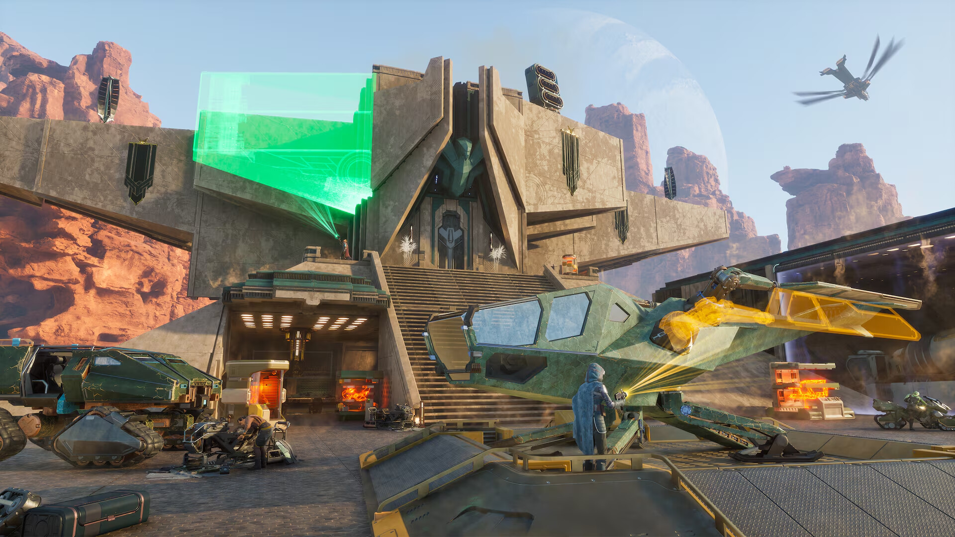 Dune: Awakening — Futuristic desert base with angular architecture, green glowing panels, and parked vehicles including a large transport and a hovering aircraft. A character in blue armor stands near the entrance, with a planet visible in the sky.