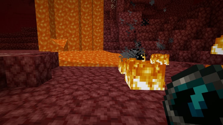 Minecraft player holding a recovery compass in the Nether near fire and lava