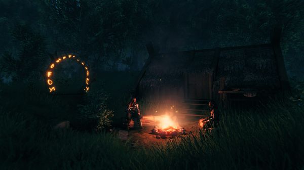 Two Valheim characters sitting by a campfire near a portal