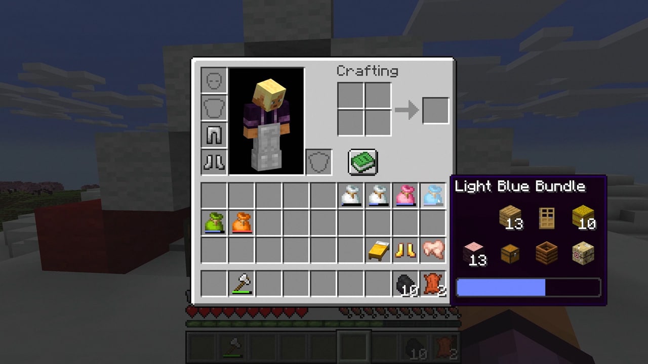 Minecraft inventory with a light-blue bundle tooltip displaying mixed contents and a fill bar